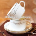 white ceramic cup and saucer with beautiful decal